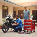 Professional mechanic repairing a motorcycle at home doorstep